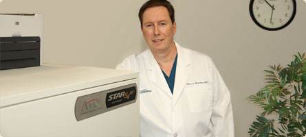 dr boothe next to the visx star s4 lasik laser